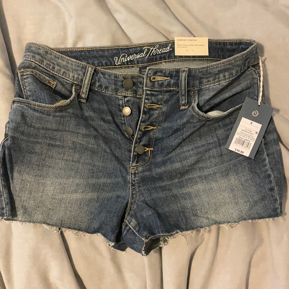 Brand new tags on button up shorts